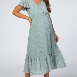Pink blush maternity light blue dress with orange and dark blue speckles.